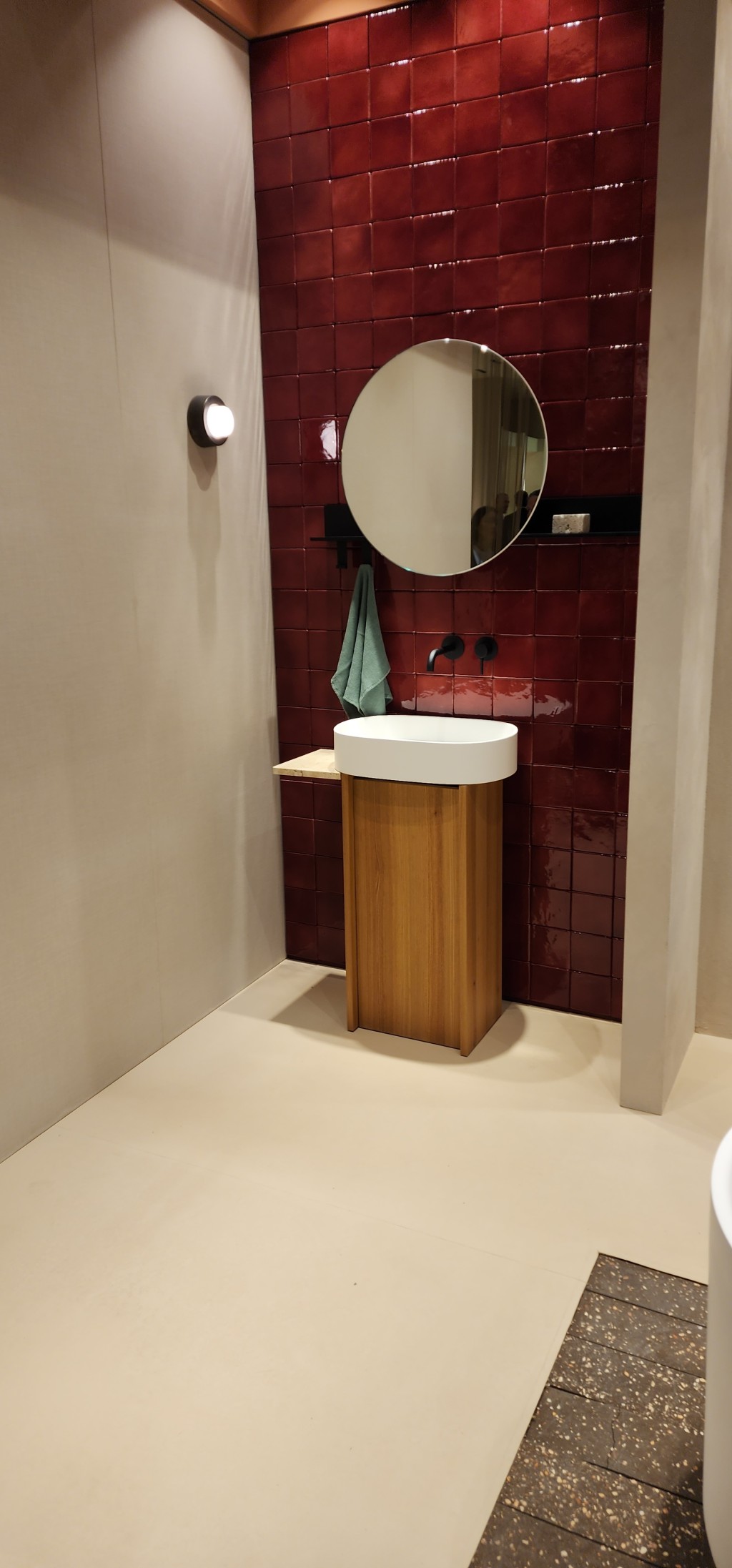 A bathroom with red tiles at Salone Internazionale del Mobile di Milano